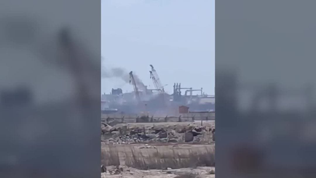 US Strikes Iran as Widening War Engulfs More Countries Across Middle East Vehicles pass a signboard near Damietta port in Egypt amid regional conflict