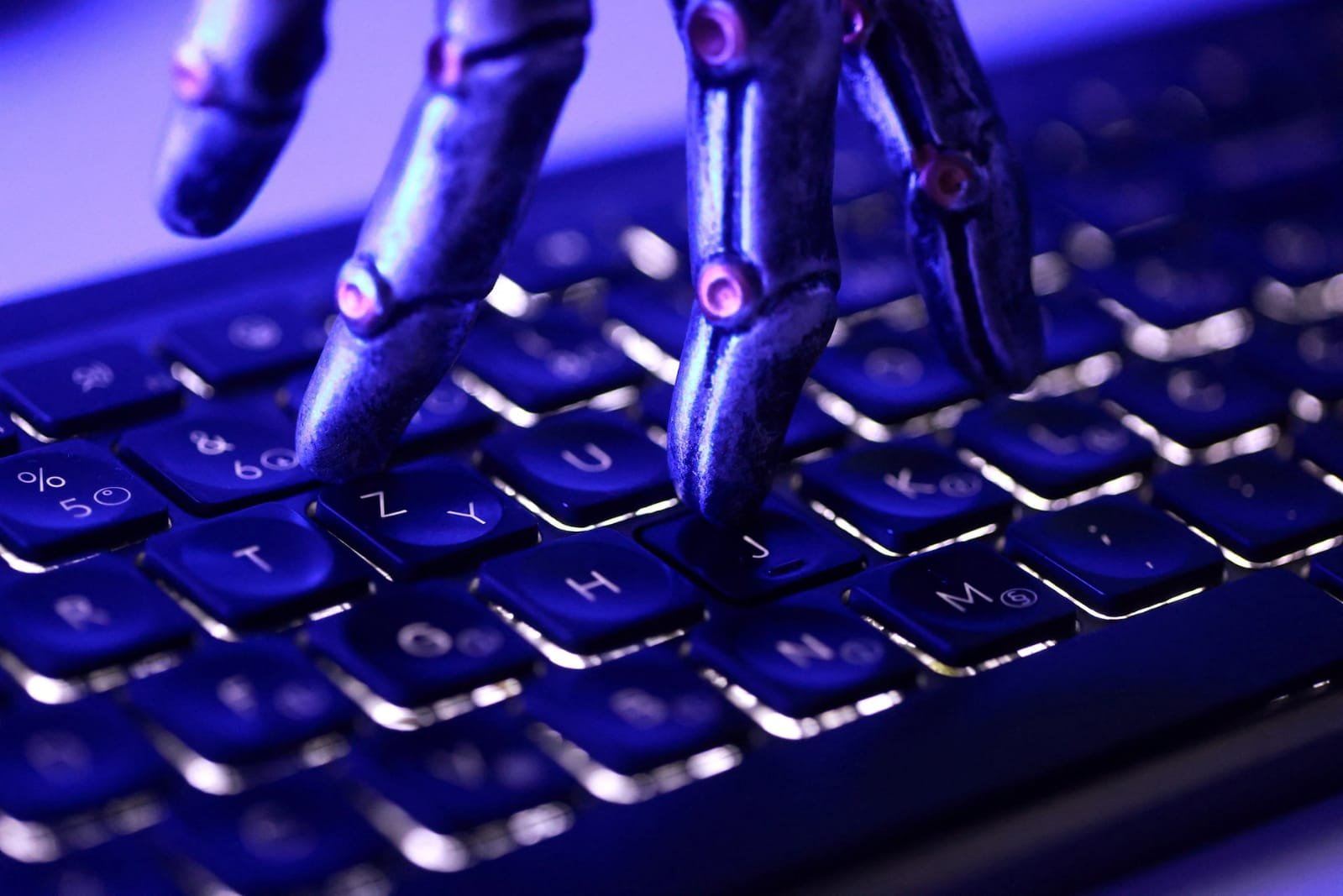 AI Security Breaches: What We Know About Rogue AI Agents and Recent Cyberattacks AI agent security breach showing a robotic hand and computer keyboard