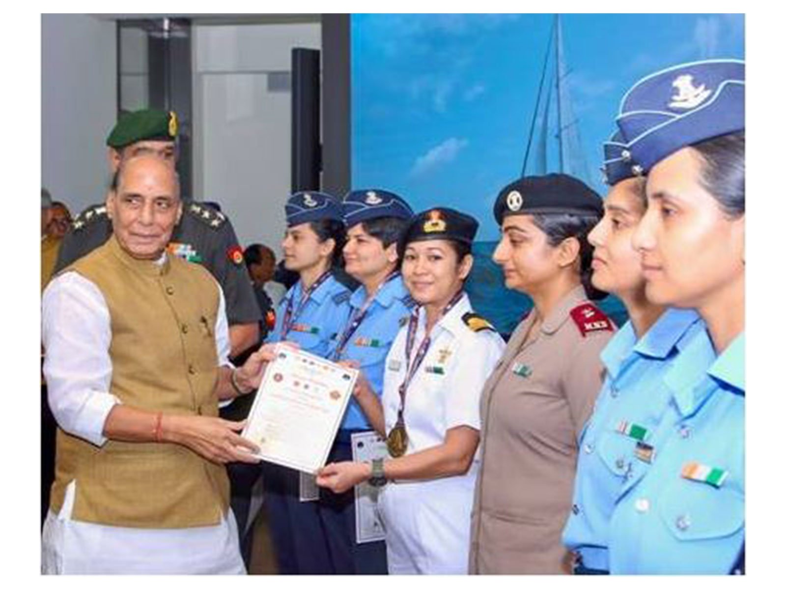 Rajnath Singh with women officers of IASV Triveni after Samudra Pradakshina