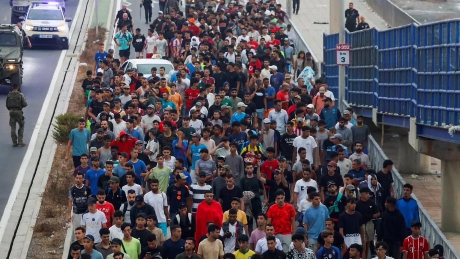 EU to Hold Emergency Meeting as Ceuta Migrant Crossings Trigger Tensions Among Member States Migrants gather near the border in Spain's Ceuta enclave during a large-scale crossing from Morocco.