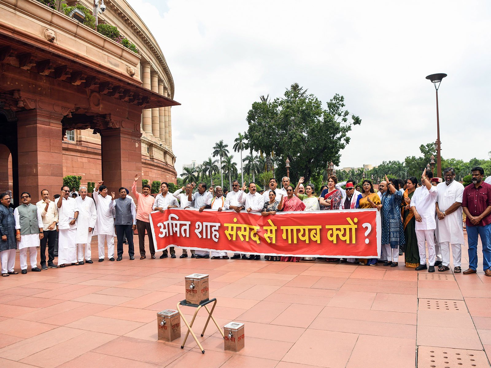 Opposition leaders protest in Parliament demanding Amit Shah's statement on the July 20 student police action.