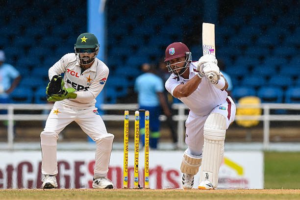 West Indies vs Pakistan 2nd Test: West Indies Reach 239/5 on Rain-Hit Day 1 as Justin Greaves Leads Fightback Against Pakistan in 2nd Test Justin Greaves plays a shot during Day 1 of the West Indies vs Pakistan second Test at Queen's Park Oval.