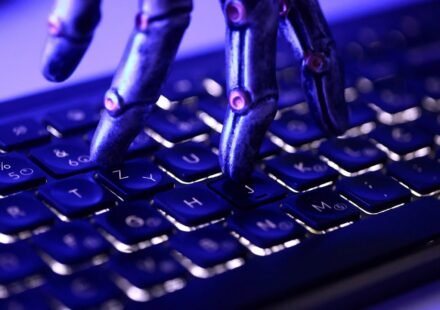 AI agent security breach showing a robotic hand and computer keyboard