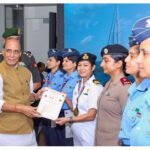 Rajnath Singh with women officers of IASV Triveni after Samudra Pradakshina