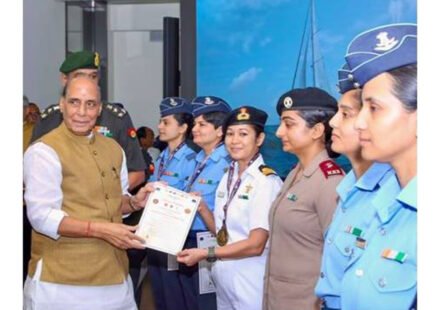 Rajnath Singh with women officers of IASV Triveni after Samudra Pradakshina