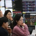 South Korea stock market traders monitor markets during a volatile Kospi session