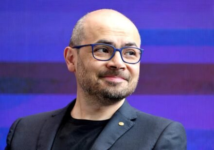 Demis Hassabis speaking at an artificial intelligence summit after Alphabet announced major AI leadership changes.