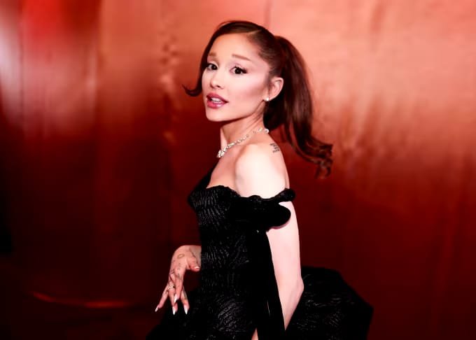 Ariana Grande performs during the Eternal Sunshine Tour while addressing fans about her planned break from public visibility.