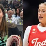 Ahnaleigh Wilson holding a Sophie Cunningham support sign during the Indiana Fever vs Seattle Storm WNBA game.