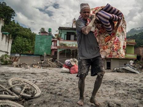 Nepal floods survivors recover belongings from destroyed homes in Devighat