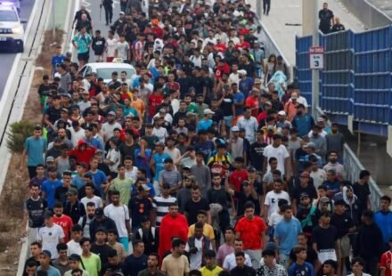 Migrants gather near the border in Spain's Ceuta enclave during a large-scale crossing from Morocco.