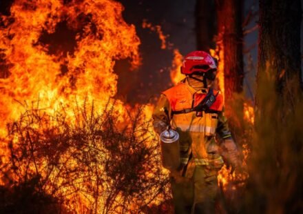 French firefighter works to contain a major wildfire near Saumos