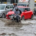 Waterlogged road in Delhi after heavy rainfall caused traffic congestion across NCR.