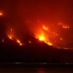 Western wildfires force evacuations across Canada and the United States