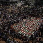 Palestinians attend a mass funeral after 112 bodies were recovered from the rubble of a 2023 strike in Gaza.