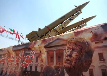 Banner showing U.S. President Donald Trump beside an Iranian missile system in Tehran amid rising Iran-US tensions.