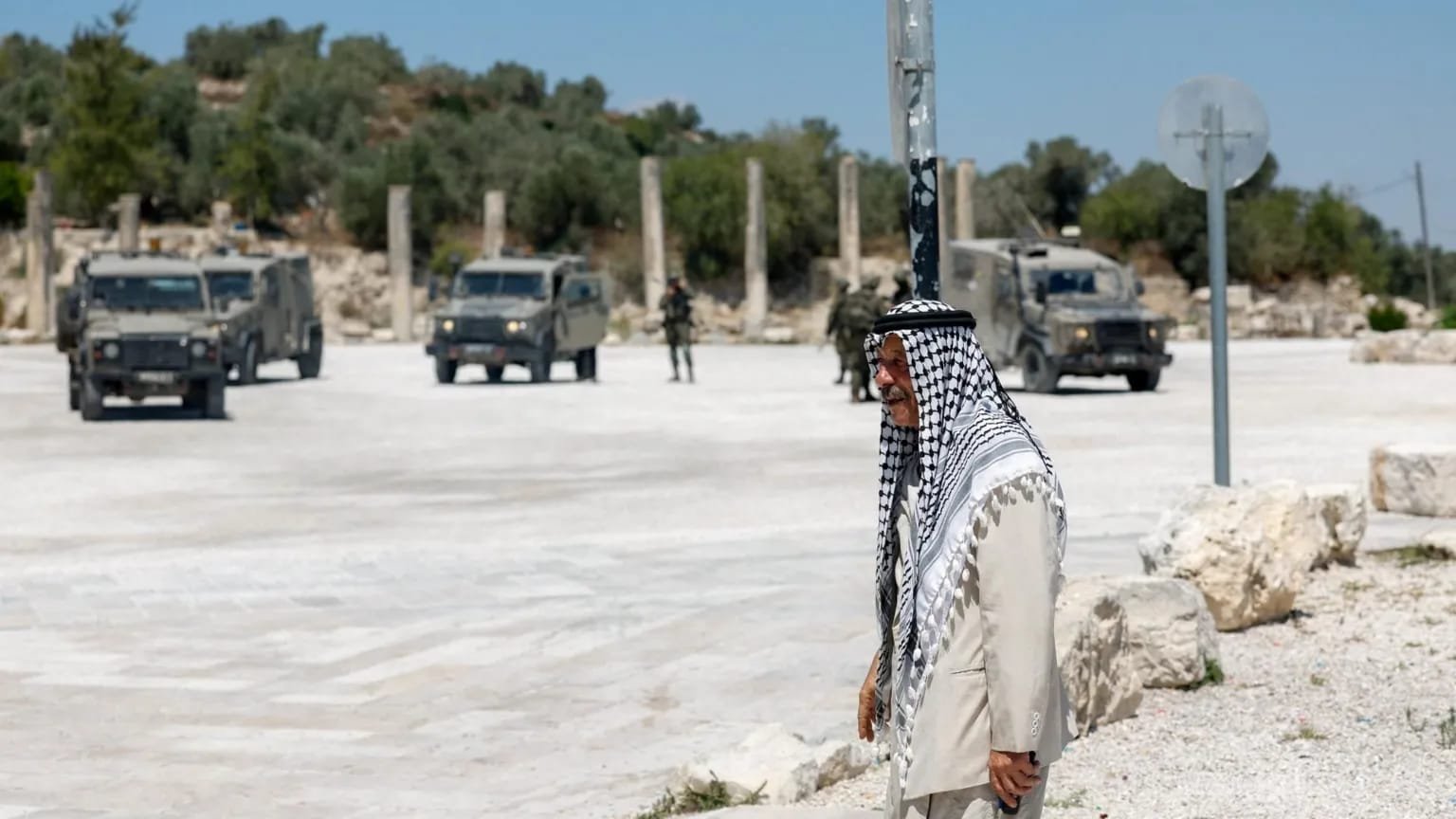 Israel Accused of Using Archaeology to Seize West Bank Land Palestinian man near Israeli troops at the archaeological site of Sebastia in the occupied West Bank