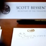 US Treasury Secretary Scott Bessent attends a Cabinet meeting at Camp David with a notepad referencing a possible Japanese yen purchase.