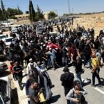 Mourners carry the body of Palestinian activist Owdeh Hathaleen during his funeral near Hebron in the occupied West Bank.